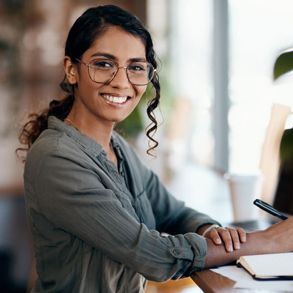 woman with glasses smiling